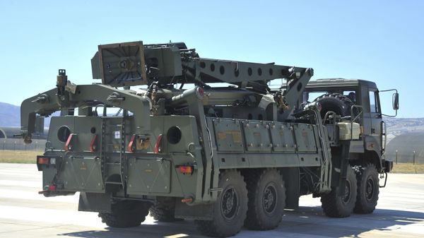 In this Tuesday, Aug. 27, 2019 file photo, a truck carrying parts of the S-400 air defense systems, exits a Russian transport aircraft after landing at Murted military airport outside Ankara, Turkey. - Sputnik International