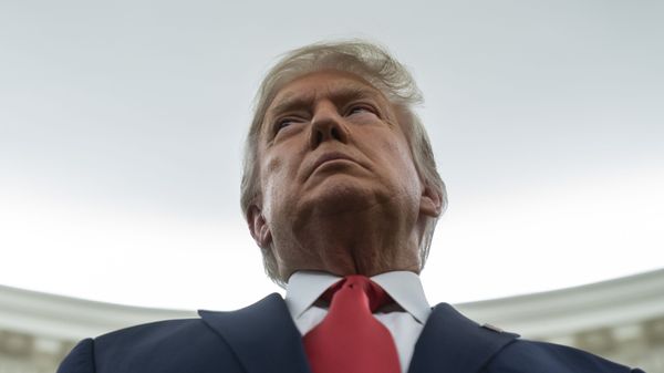 President Donald Trump listens during a ceremony to present the Presidential Medal of Freedom to former football coach Lou Holtz, in the Oval Office of the White House, Thursday, 3 December 2020. - Sputnik International