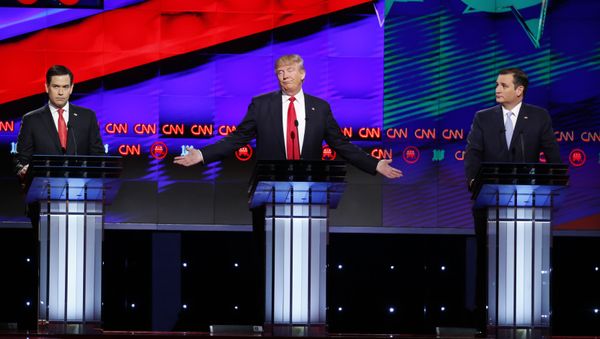 The Republican presidential hopefuls, Donald Trump, centre, Florida Senator Marco Rubio, left, and Texas Senator Ted Cruz, right, make their pitch during the Republican presidential debate sponsored by CNN, Salem Media Group and the Washington Times at the University of Miami, Thursday, 10 March 2016, in Coral Gables, Florida. - Sputnik International