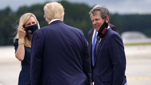 President Donald Trump greets Georgia Gov. Brian Kemp and his wife Marty as he arrives at Dobbins Air Reserve Base for a campaign event at the Cobb Galleria Centre, 25 September 2020, in Atlanta. President Donald Trump greets Georgia Gov. Brian Kemp and his wife Marty as he arrives at Dobbins Air Reserve Base for a campaign event at the Cobb Galleria Centre, 25 September 2020, in Atlanta. - Sputnik International