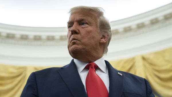 President Donald Trump listens to a question during a ceremony to present the Presidential Medal of Freedom to former football coach Lou Holtz, in the Oval Office of the White House, Thursday, Dec. 3, 2020, in Washington. President Donald Trump listens to a question during a ceremony to present the Presidential Medal of Freedom to former football coach Lou Holtz, in the Oval Office of the White House, Thursday, Dec. 3, 2020, in Washington. - Sputnik International
