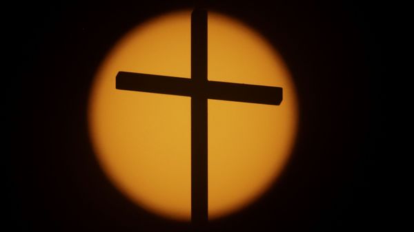 The cross on top of the First Baptist Church is silhouetted in front of the sun on Sunday, Aug. 20, 2017, in Simpsonville, S.C. South Carolina is gearing up for a total solar eclipse, which will cross the state diagonally during a phenomenon that will be seen across the country The cross on top of the First Baptist Church is silhouetted in front of the sun on Sunday, Aug. 20, 2017, in Simpsonville, S.C. South Carolina is gearing up for a total solar eclipse, which will cross the state diagonally during a phenomenon that will be seen across the country - Sputnik International