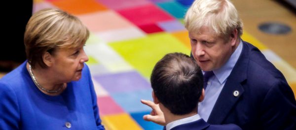 British Prime Minister Boris Johnson (R), French President Emmanuel Macron (C) and German Chancellor Angela Merkel (L) speak upon their arrival for a round table meeting as part of a European Union summit at European Union Headquarters in Brussels on October 17, 2019. - Sputnik International
