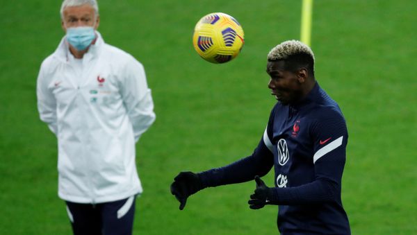 Soccer Football - UEFA Nations League - France Training - Stade de France, Saint-Denis, France - November 16, 2020  France's Paul Pogba as coach Didier Deschamps looks on during training - Sputnik International