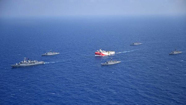 This handout photograph released by the Turkish Defence Ministry on August 12, 2020, shows Turkish seismic research vessel 'Oruc Reis' (C) as it is escorted by Turkish Naval ships in the Mediterranean Sea, off Antalya on August 10, 2020.  - Sputnik International