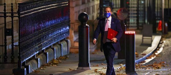 Britain's Health Secretary Matt Hancock wears an NHS face mask outside 10 Downing Street, in London, Britain, 16 November 2020 - Sputnik International