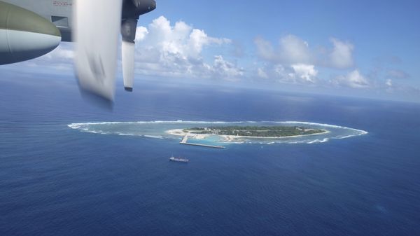 An aerial view shows a vessel preparing for a search-and-rescue exercise off Taiping island, in the South China Sea , Tuesday, Nov. 29, 2016, as part of efforts to cement its claim to a key island in the strategically vital waterbody. Eight vessels and three aircraft took part in Tuesday's drill, which simulated a fire aboard a cargo ship that forced crew members to seek safety on Taiping in the Spratly island group. - Sputnik International