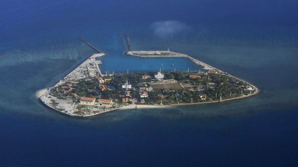 The Vietnamese-claimed Southwest Cay island in the Spratly island group is seen from a Philippine Air Force C-130 transport plane during the visit to the Philippine-claimed Thitu Island by Defense Secretary Delfin Lorenzana, Armed Forces Chief Gen. Eduardo Ano and other officials in disputed South China Sea, western Philippines, Friday, April 21, 2017. - Sputnik International