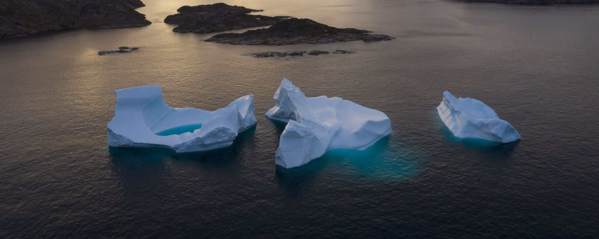 In this Aug. 16, 2019 file photo, icebergs float away as the sun rises near Kulusuk, Greenland In this Aug. 16, 2019 file photo, icebergs float away as the sun rises near Kulusuk, Greenland - Sputnik International, 1920, 03.02.2022