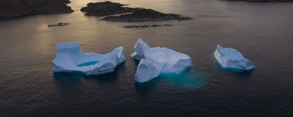 In this 16 August 2019 file photo, icebergs float away as the sun rises near Kulusuk, Greenland In this 16 August 2019 file photo, icebergs float away as the sun rises near Kulusuk, Greenland - Sputnik International