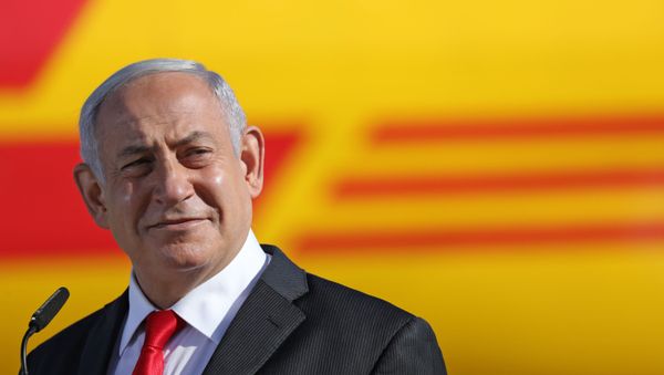 Israeli Prime Minister Benjamin Netanyahu attends a ceremony to mark the arrival of a plane of the international courier company DHL, carrying over 100,000 of doses of the first batch of Pfizer vaccines which landed at Ben Gurion Airport near Tel Aviv, on December 9, 2020.  - Sputnik International