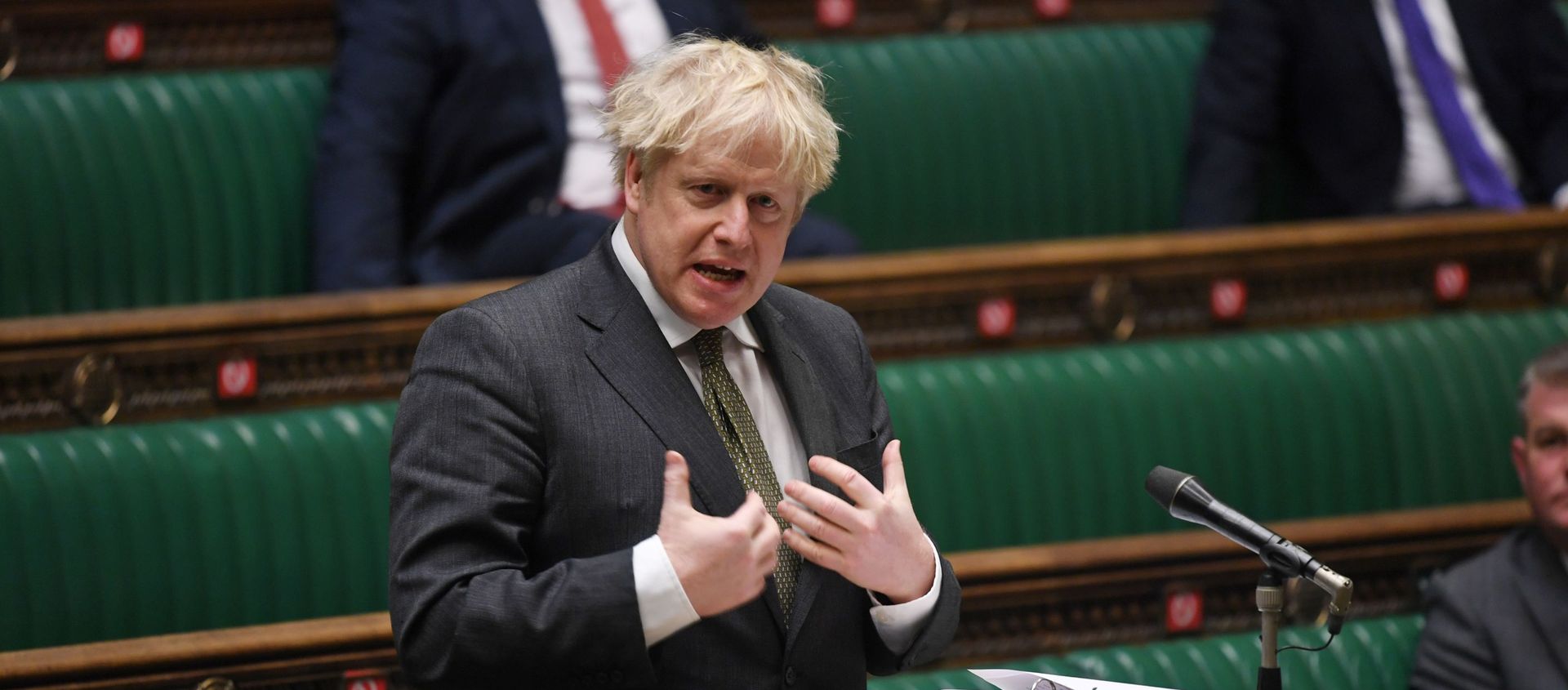 A handout photograph released by the UK Parliament shows Britain's Prime Minister Boris Johnson speaking during Prime Minister's Questions (PMQs) in the House of Commons, in central London on December 9, 2020. A handout photograph released by the UK Parliament shows Britain's Prime Minister Boris Johnson speaking during Prime Minister's Questions (PMQs) in the House of Commons, in central London on December 9, 2020. - Sputnik International, 1920, 27.12.2020