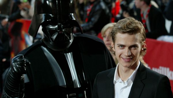 Actor Hayden Christensen poses next to a film character in front of a cinema at the Potsdamer Platz square in Berlin on Tuesday, May 17, 2005 - Sputnik International