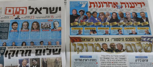 This picture taken on December 11, 2020 in Jerusalem shows Israeli newspapers' front page titles about the announcement that Israel is to establish diplomatic relations with Morocco. - Outgoing President Donald Trump's double announcement of a normalisation of ties between Morocco and Israel and US recognition of Moroccan sovereignty over Western Sahara has prompted mixed reactions. In a statement by the royal palace, Morocco's King Mohammed VI confirmed on December 10 that his country would resume official contacts.... and diplomatic relations with minimal delay with Israel, two decades after the two countries closed liaison offices.  - Sputnik International