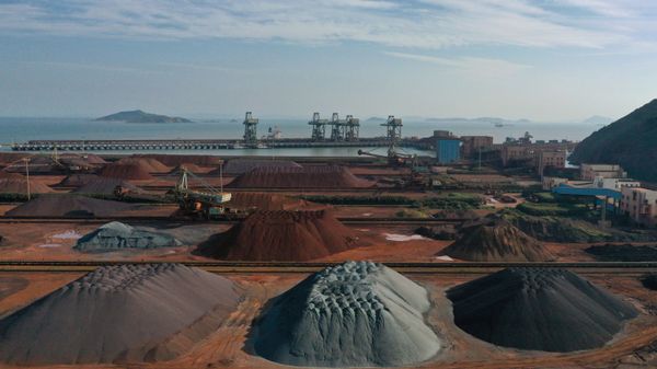 FILE PHOTO: Piles of imported iron ore are seen at a port in Zhoushan, Zhejiang - Sputnik International