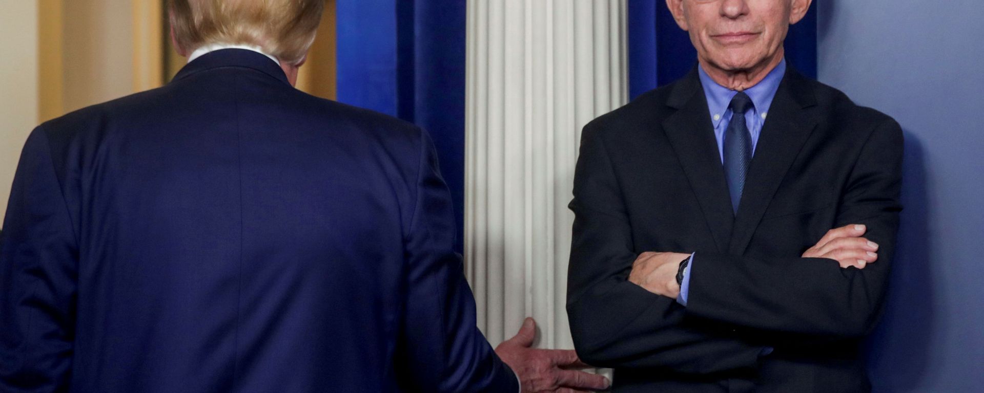US President Donald Trump departs after addressing the coronavirus task force daily briefing as Dr. Anthony Fauci, director of the National Institute of Allergy and Infectious Diseases, stands by at the White House in Washington, 26 March 2020. US President Donald Trump departs after addressing the coronavirus task force daily briefing as Dr. Anthony Fauci, director of the National Institute of Allergy and Infectious Diseases, stands by at the White House in Washington, 26 March 2020. - Sputnik International, 1920, 25.01.2021