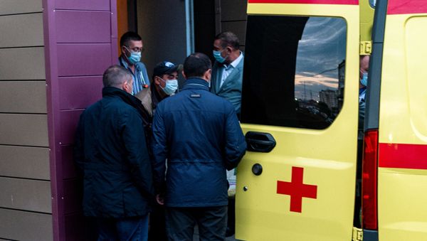 Medics load Alexei Navalny in an ambulance at Omsk Emergency Hospital No 1 where Navalny was admitted after he fell ill in what his spokeswoman said was a suspected poisoning in Omsk on August 22, 2020. - - Sputnik International