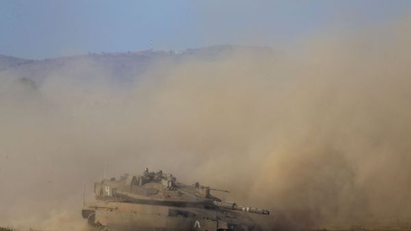 Israeli soldiers drive a tank during an exercise in the Israeli controlled Golan Heights near the border with Syria, Tuesday, Aug. 4, 2020 - Sputnik International