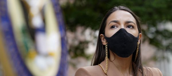 Rep. Alexandria Ocasio-Cortez, D-NY, wears a protective mask as she waits to speak during a news conference outside the USPS Jamaica station, Tuesday, Aug. 18, 2020, in the Queens borough of New York. The Postal Service said it has stopped removing mailboxes and mail-sorting machines amid an outcry from lawmakers, as President Donald Trump denied he was slowing service. Democrats and some Republicans say actions by a Trump ally and a major Republican donor, new Postmaster General Louis DeJoy, have endangered millions of Americans who rely on the Postal Service for prescription drugs and other needs. Rep. Alexandria Ocasio-Cortez, D-NY, wears a protective mask as she waits to speak during a news conference outside the USPS Jamaica station, Tuesday, Aug. 18, 2020, in the Queens borough of New York. The Postal Service said it has stopped removing mailboxes and mail-sorting machines amid an outcry from lawmakers, as President Donald Trump denied he was slowing service. Democrats and some Republicans say actions by a Trump ally and a major Republican donor, new Postmaster General Louis DeJoy, have endangered millions of Americans who rely on the Postal Service for prescription drugs and other needs. - Sputnik International