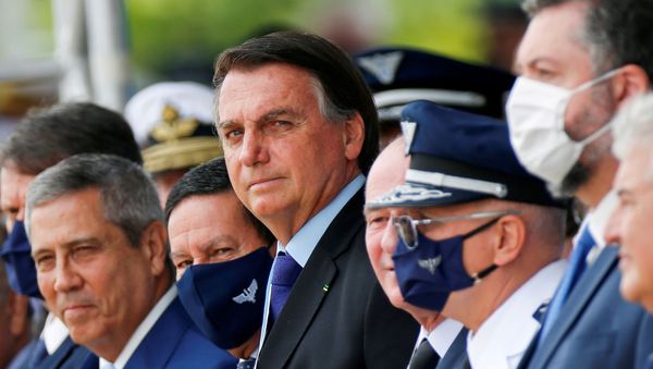 Brazil's President Jair Bolsonaro (C) looks on during a ceremony of Aviator's Day at Brasilia Air Base in Brasilia, Brazil October 23, 2020.  - Sputnik International