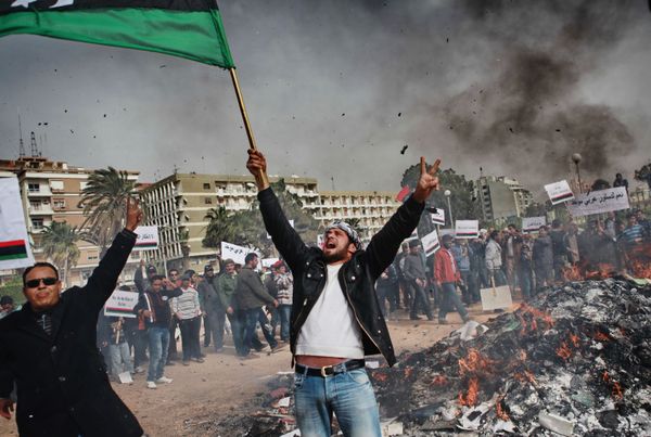 Residents of Benghazi burn portraits of Muammar Gaddafi, posters with his quotes, and his Green Book Residents of Benghazi burn portraits of Muammar Gaddafi, posters with his quotes, and his Green Book - Sputnik International