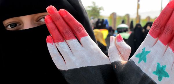 Yemeni woman holds up her hands painted in the colours of the Yemeni flag (L) and the Syrian flag during a mass protest against the rule of President Ali Abdullah Saleh in the capital Sanaa Yemeni woman holds up her hands painted in the colours of the Yemeni flag (L) and the Syrian flag during a mass protest against the rule of President Ali Abdullah Saleh in the capital Sanaa - Sputnik International