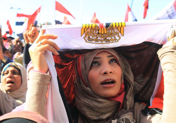 An Egyptian woman covers her head in a national flag as she demonstrates in Cairo's Tahrir Square on 27 January 2012 An Egyptian woman covers her head in a national flag as she demonstrates in Cairo's Tahrir Square on 27 January 2012 - Sputnik International
