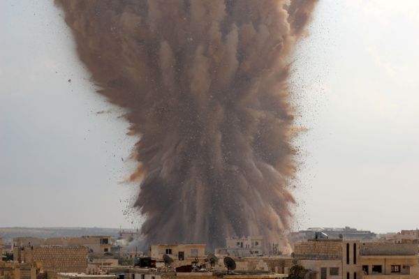 A picture taken on 14 October 2014 shows a large explosion allegedly hitting a Syrian Army military outpost in the southern part of the city of Maaret al-Numan in Idlib province A picture taken on 14 October 2014 shows a large explosion allegedly hitting a Syrian Army military outpost in the southern part of the city of Maaret al-Numan in Idlib province - Sputnik International
