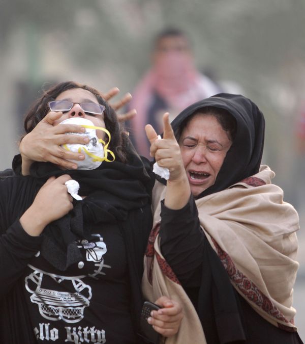 Anti-government protesters react to tear gas fired by riot police during clashes on Saturday, 17 December 2011, in Abu Saiba village west of the capital of Manama, Bahrain Anti-government protesters react to tear gas fired by riot police during clashes on Saturday, 17 December 2011, in Abu Saiba village west of the capital of Manama, Bahrain - Sputnik International