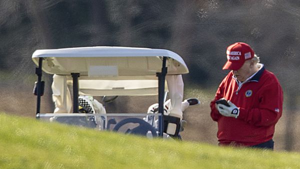 US President Donald Trump makes a phone call as he golfs at Trump National Golf Club on November 26, 2020 in Sterling, Virginia - Sputnik International