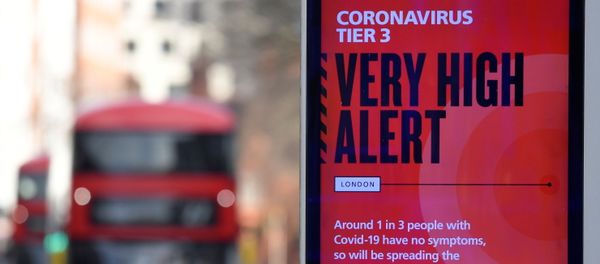 A British government health information advertisement highlighting new restrictions amid the spread of the coronavirus disease (COVID-19) is seen in London, Britain, 19 December 2020.  - Sputnik International