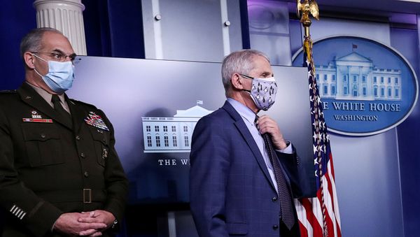U.S. Army Gen. Gustave Perna, who co-leads the Trump administration effort dubbed Operation Warp Speed to find a vaccine for the coronavirus disease (COVID-19), and Dr. Anthony Fauci, director of the National Institute of Allergy and Infectious Diseases, listen during a briefing by the White House coronavirus task force in the Brady press briefing room at the White House in Washington, U.S., November 19, 2020.  - Sputnik International