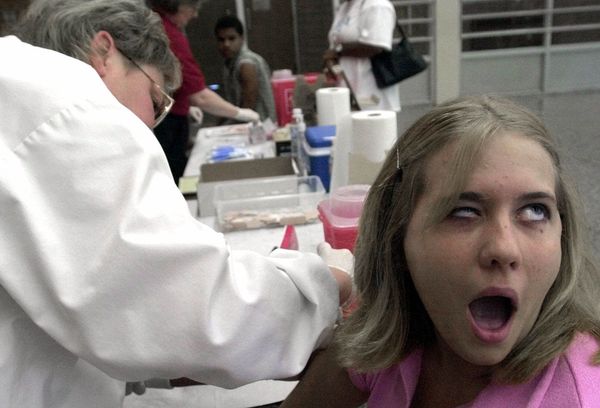 Michelle Krebs, 18, reacts as she is vaccinated by school nurse Jill Kuhns, Friday, 8 June, 2001 a Salem High School in Salem, Ohio. Michelle Krebs, 18, reacts as she is vaccinated by school nurse Jill Kuhns, Friday, 8 June, 2001 a Salem High School in Salem, Ohio. - Sputnik International