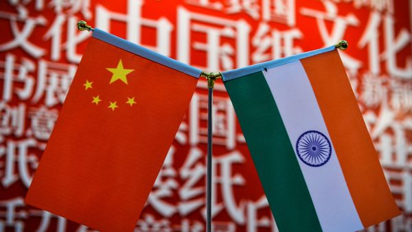 The national flags of India (R) and China are seen at the Delhi World Book fair at Pragati Maidan in New Delhi on January 9, 2016.  - Sputnik International