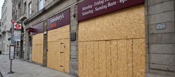 The boarded-up front of a Sainsbury's Local supermarket is pictured on Fleet Street in central London on May 3, 2020, during the nationwide lockdown due to the novel coronavirus COVID-19 pandemic. The boarded-up front of a Sainsbury's Local supermarket is pictured on Fleet Street in central London on May 3, 2020, during the nationwide lockdown due to the novel coronavirus COVID-19 pandemic. - Sputnik International
