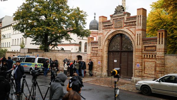 Journalists are seen on October 10, 2019 at synagogue in Halle, eastern Germany, one day after the attack where two people were shot dead - Sputnik International