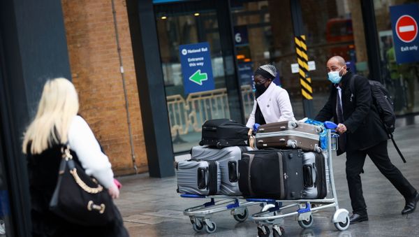 Travellers walk with their luggage at King's Cross station, as EU countries impose a travel ban from the UK following the coronavirus disease (COVID-19) outbreak, in London, Britain, December 21, 2020. Travellers walk with their luggage at King's Cross station, as EU countries impose a travel ban from the UK following the coronavirus disease (COVID-19) outbreak, in London, Britain, December 21, 2020. - Sputnik International