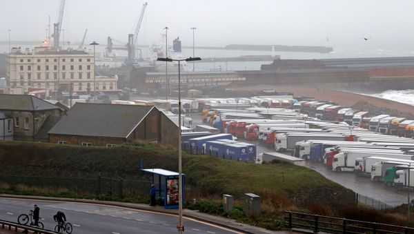 Freight lorries and goods vehicles are pictured parked in a paring lot near the Port of Dover in in Dover, Kent, on the south east coast of England on December 21, 2020 - Sputnik International