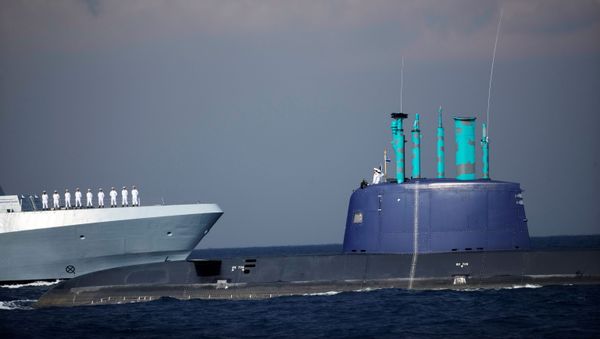 Israeli sailors stand in formation on the Saar-6 corvette, a warship dubbed Shield, as it passes a naval submarine, during a welcoming ceremony by the Israeli navy to mark the arrival of the warship, in the Mediterranean Sea off the coast of Haifa, northern Israel December 1, 2020 - Sputnik International