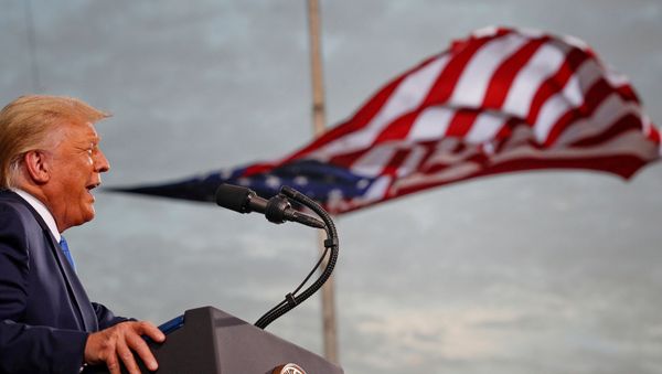 President Donald Trump speaks, with a flag behind him, during a campaign rally at Cecil Airport in Jacksonville, Florida, U.S., September 24, 2020 - Sputnik International