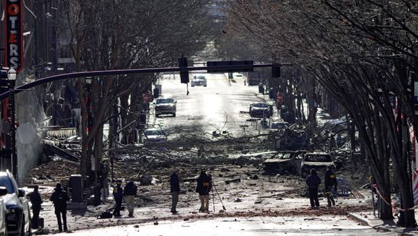 Investigators work near the site of an explosion on 2nd Avenue that occurred the day before in Nashville, Tennessee, U.S. December 26, 2020. - Sputnik International