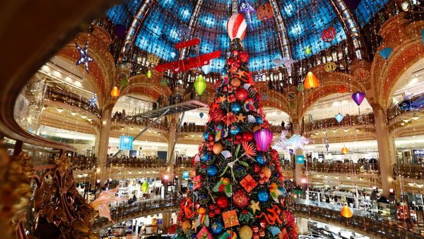 A giant Christmas tree stands at the Galeries Lafayette department store where lights were switched on for the festive season in Paris, France, November 30, 2020. A giant Christmas tree stands at the Galeries Lafayette department store where lights were switched on for the festive season in Paris, France, November 30, 2020. - Sputnik International