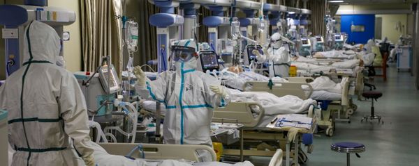 Medical workers in protective suits attend to novel coronavirus patients at the intensive care unit (ICU) of a designated hospital in Wuhan, Hubei Province, China, February 6, 2020. Medical workers in protective suits attend to novel coronavirus patients at the intensive care unit (ICU) of a designated hospital in Wuhan, Hubei Province, China, February 6, 2020. - Sputnik International