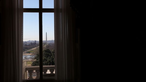 The Washington Monument can be seen through a window on the Senate side of the U.S. Capitol building before the House is expected to vote on increasing the second round of federal direct payments to $2,000 on Capitol Hill Washington, U.S., December 28, 2020.  - Sputnik International