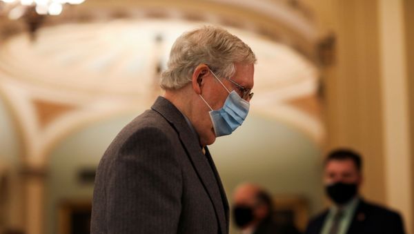 Senate Majority Leader Mitch McConnell leaves the Senate floor as he and the rest of the U.S. Senate face a decision over approving $2,000 stimulus checks on Capitol Hill in Washington, U.S., December 30, 2020. - Sputnik International