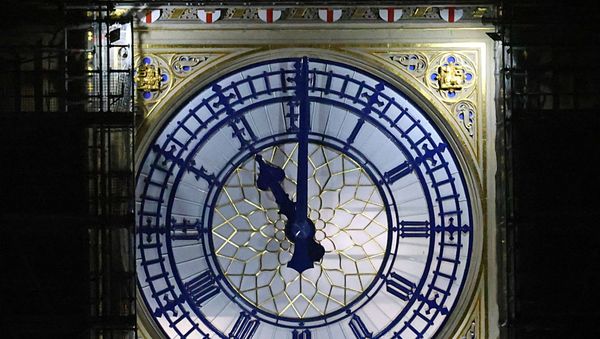 A clockface of the Elizabeth Tower at the Houses of Parliament, more commonly known as Big Ben, shows 2300 GMT, as Britain formally exits the EU, in London, Britain December 31, 2020. - Sputnik International