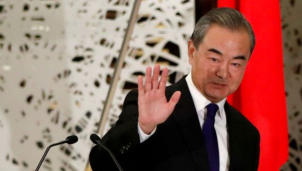 China's State Councillor and Foreign Minister Wang Yi waves as he leaves a news conference in Tokyo, Japan, November 24, 2020. REUTERS/Issei Kato/Pool/File Photo China's State Councillor and Foreign Minister Wang Yi waves as he leaves a news conference in Tokyo, Japan, November 24, 2020. REUTERS/Issei Kato/Pool/File Photo - Sputnik International