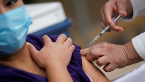 A medical worker receives an injection with a dose of the Pfizer-BioNTech COVID-19 vaccine at the Regional Military Specialty Hospital in San Nicolas de los Garza, on the outskirts of Monterrey, Mexico 29 December, 2020 A medical worker receives an injection with a dose of the Pfizer-BioNTech COVID-19 vaccine at the Regional Military Specialty Hospital in San Nicolas de los Garza, on the outskirts of Monterrey, Mexico 29 December, 2020 - Sputnik International