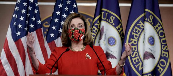 Speaker of the House Nancy Pelosi, D-CA., speaks to reporters on an agreement of a coronavirus disease (COVID-19) aid package on Capitol Hill in Washington, D.C., U.S., December 20, 2020 - Sputnik International