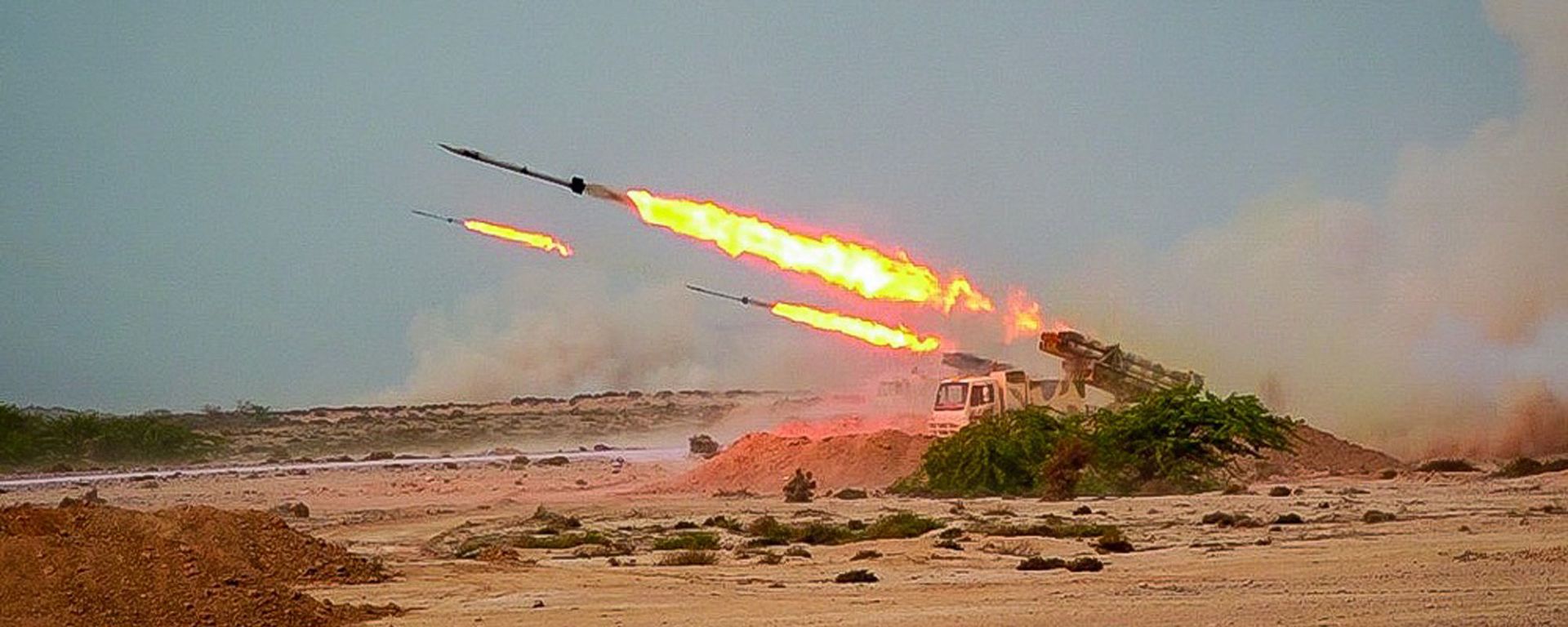 In this photo released Tuesday, July 28, 2020, by Sepahnews, missiles are fired in a Revolutionary Guard military exercise. Iran's paramilitary Revolutionary Guard fired a missile from a helicopter targeting the mock-up aircraft carrier in the strategic Strait of Hormuz. That's according to footage aired on state television on Tuesday. Iranian commandos also fast-roped down from a helicopter onto the replica in the footage from the exercise called Great Prophet 14. The drill appears aimed at threatening the U.S. amid tensions between Tehran and Washington. - Sputnik International, 1920, 07.03.2021